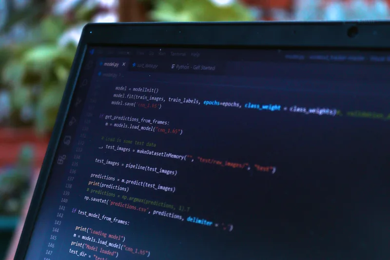 Close-up view of a computer screen displaying code, representing the template-editing work involved in a developer-level WooCommerce email customization