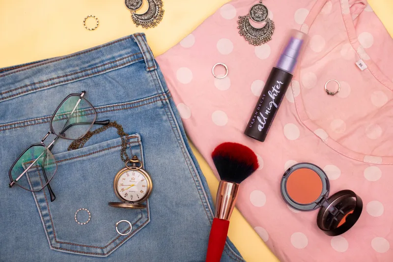 Fashion and beauty product flat lay representing product selection decisions for Lazada sponsored advertising in the Philippines