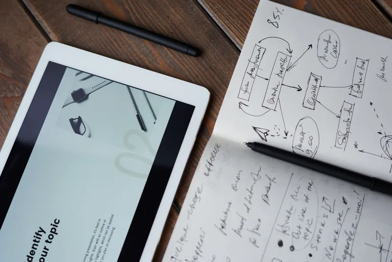 Notebook and pen on a desk, representing email campaign and automation sequence planning