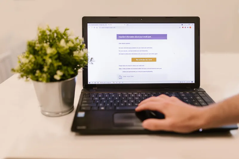 Person reading an email on a laptop indoors